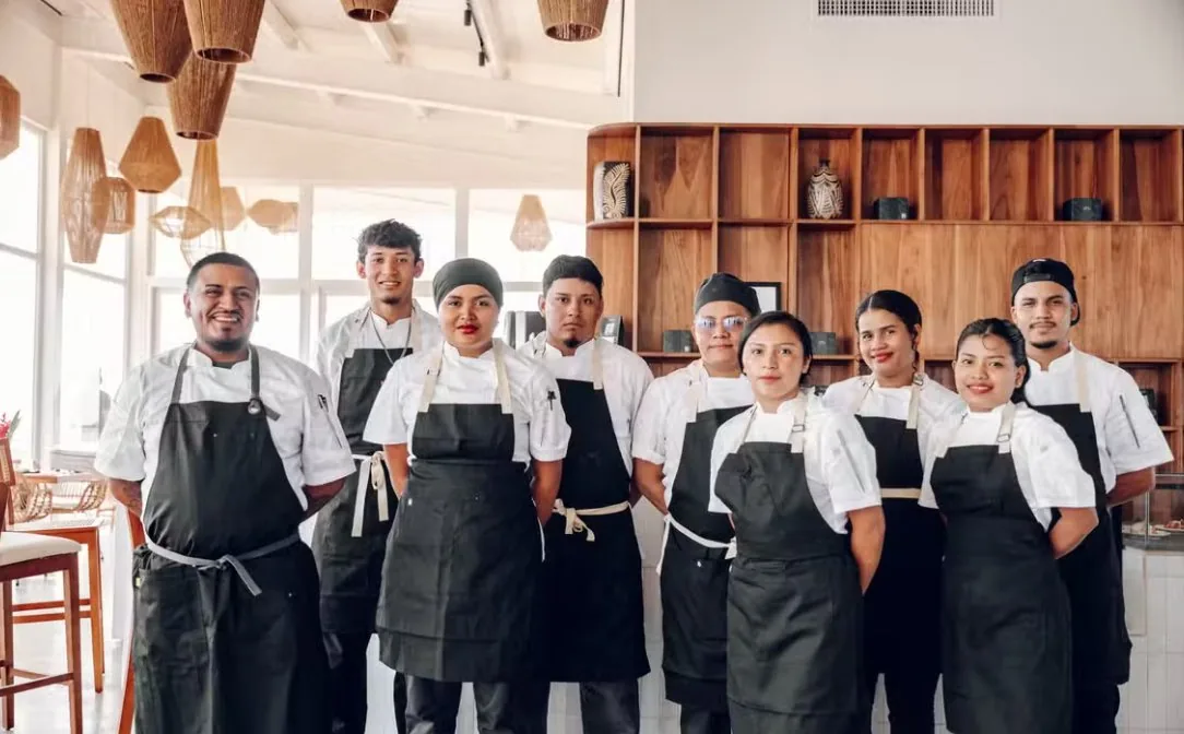 Restaurant team together in a commercial kitchen